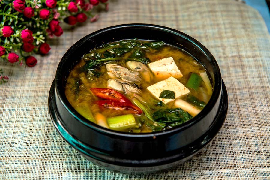 Image of a bowl of miso soup, which can contain the probiotic lactobacillus gasseri